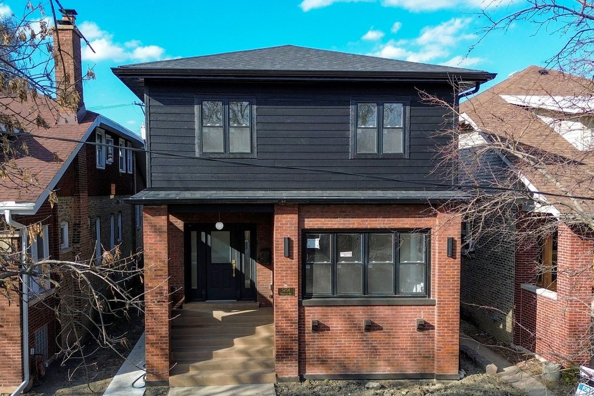 Rear brick elevation of a two-flat. The housing stock in Uptown and Andersonville is mostly brick two-flats.